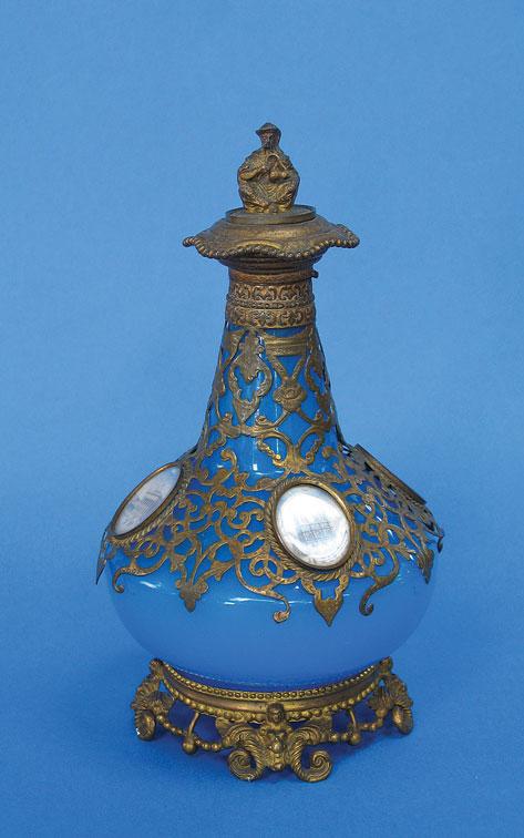 Appraisal: A FRENCH PALE BLUE GLASS VASE with gilt metal mounts