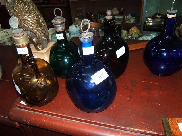 Appraisal: Five various th Century and later coloured glass decanters each