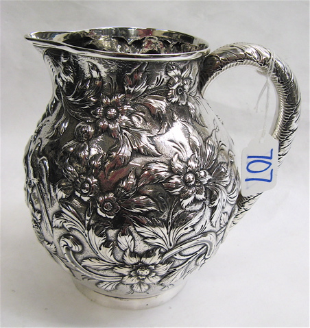 Appraisal: AMERICAN STERLING SILVER PITCHER c before all over repousse pattern