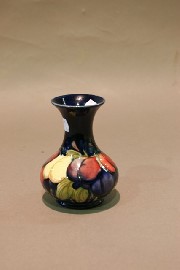 Appraisal: A small Moorcroft baluster vase decorated with the wisteria design