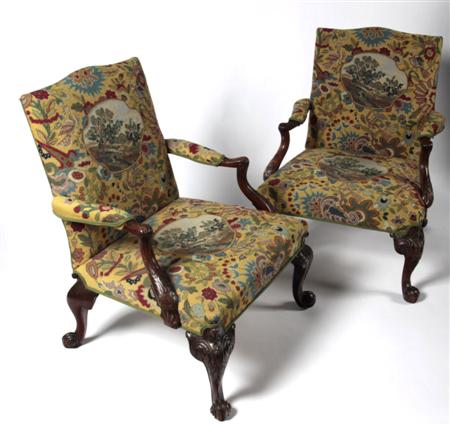 Appraisal: A pair of Chippendale style mahogany armchairs each with arched