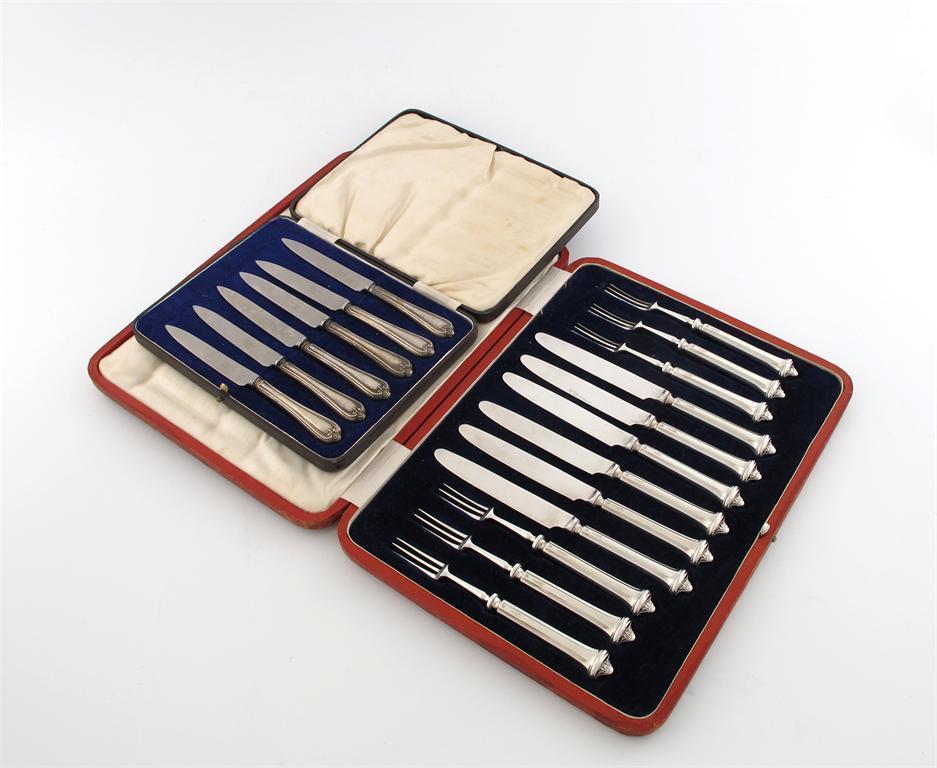 Appraisal: A set of six silver-handled fruit knives and forks