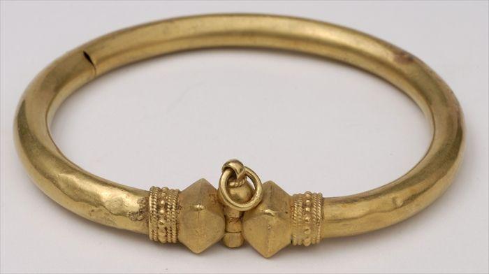 Appraisal: LARGE GOLD PERSIAN-STYLE BRACELET Provenance Property from the Collection of