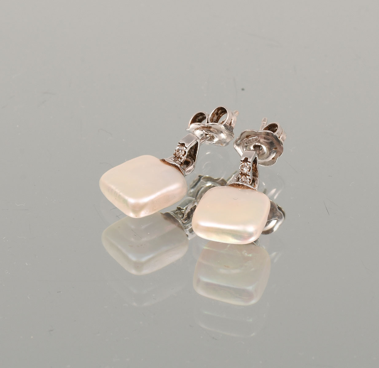 Appraisal: K WHITE GOLD PEARL AND DIAMOND EARRINGS This beautiful pair