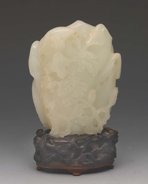 Appraisal: A CHINESE MUTTON FAT JADE VASE carved as a flower