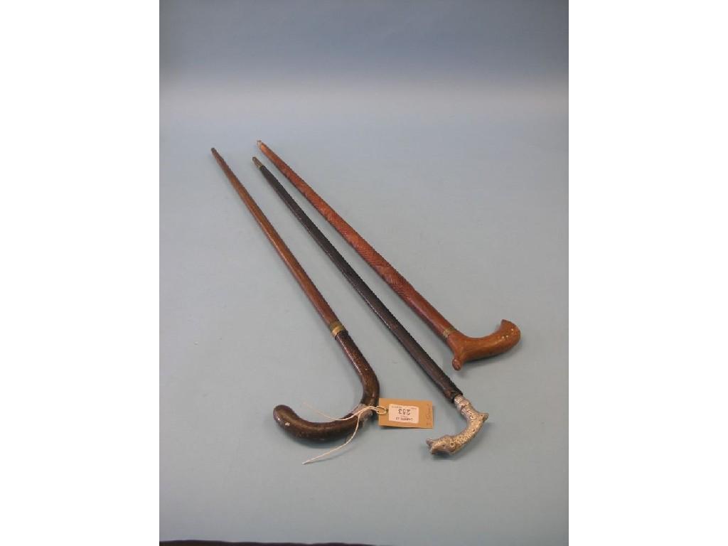 Appraisal: Three various walking-sword sticks