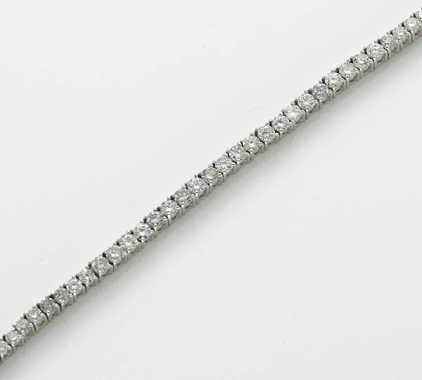 Appraisal: A diamond and platinum line bracelet estimated total diamond weight