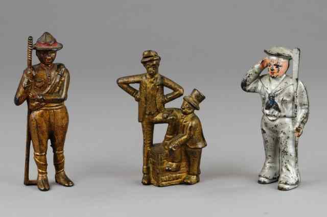 Appraisal: GROUPING OF FIGURAL STILL BANKS Cast iron includes silver painted