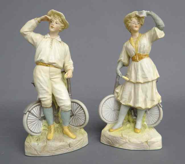 Appraisal: Pair th c Heubach bisque cyclist man and woman figurines