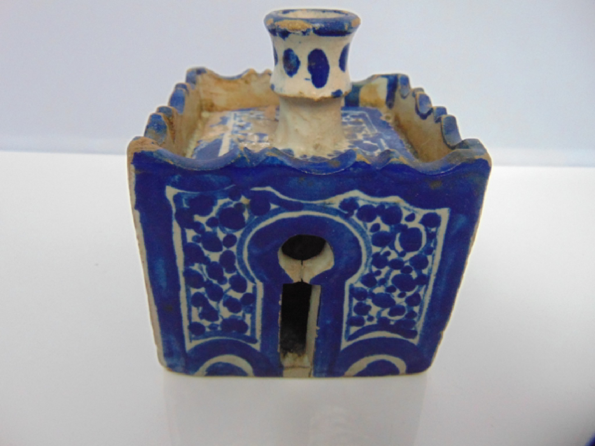 Appraisal: A four sided ink well candle holder of Iznik type