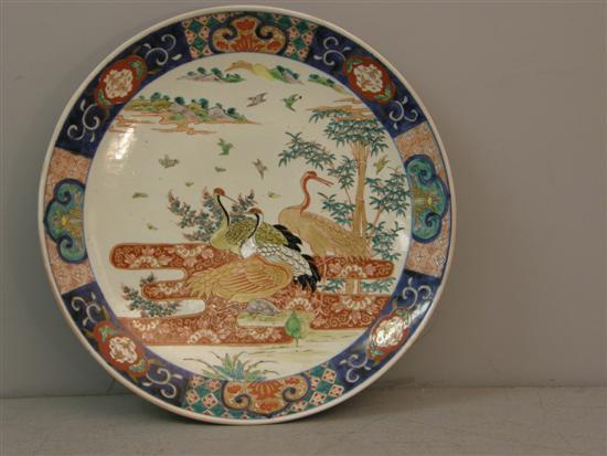 Appraisal: Chinese famille rose dish decorated with four storks diameter