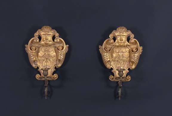 Appraisal: Pair of Italian Brass-Mounted Carved Giltwood Single-Light Appliques of cartouche