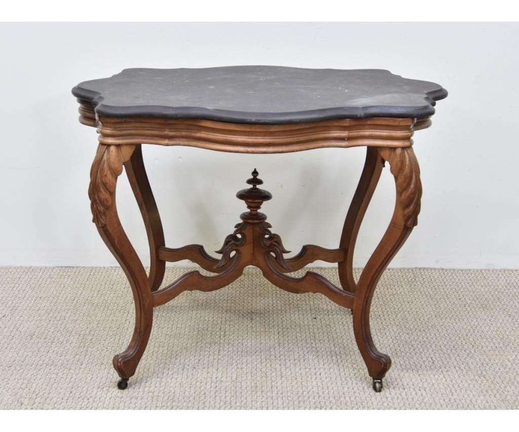 Appraisal: Victorian carved walnut table with shaped slate top h x