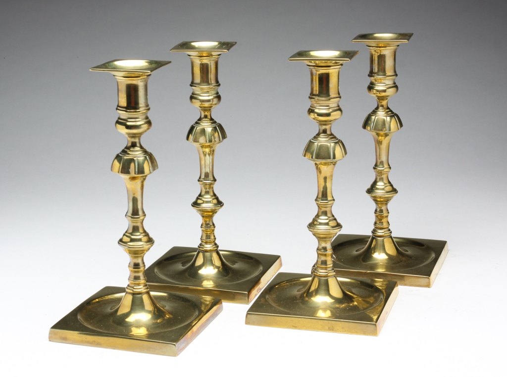 Appraisal: FOUR ENGLISH QUEEN ANNE BRASS CANDLESTICKS Mid th century Seamed