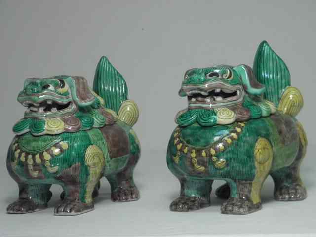 Appraisal: Pair of Chinese porcelain foo dog form jars Each is