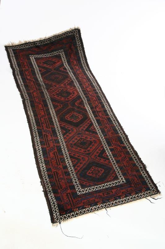 Appraisal: ORIENTAL RUG Iran ca Belouch Geometric with shades of brown