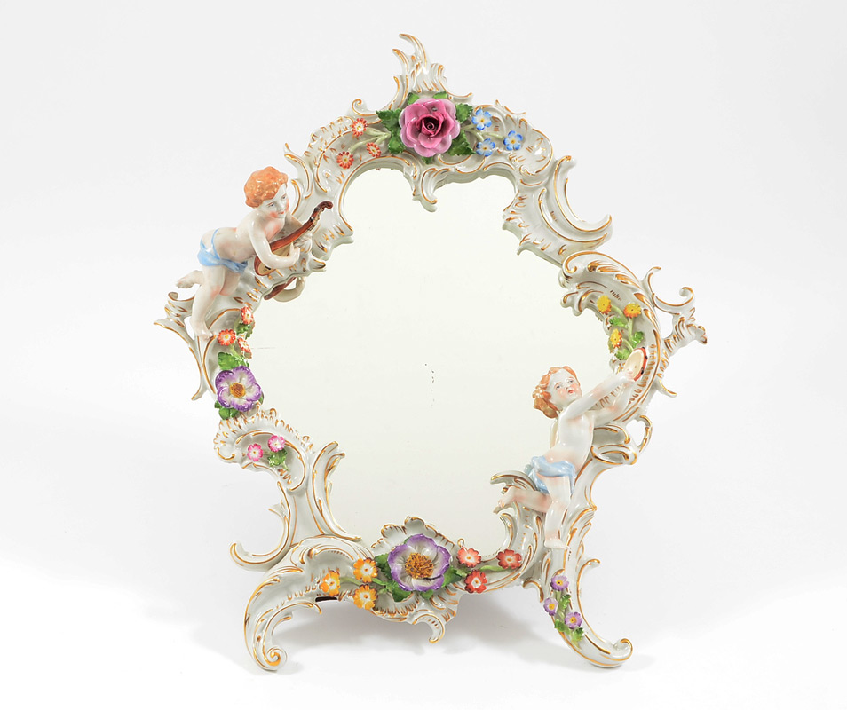 Appraisal: DRESDEN QUALITY PORCELAIN PUTTI MIRROR Easel back mirror with figural