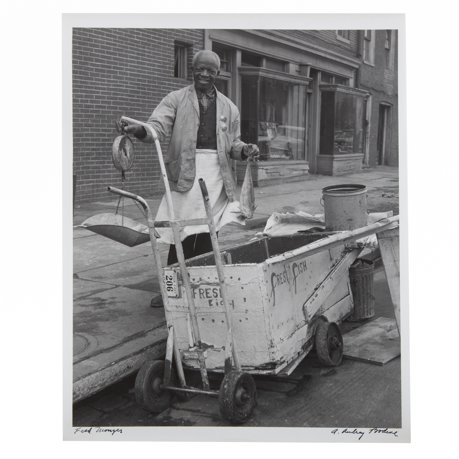 Appraisal: A AUBREY BODINE FISH MONGER PHOTOGRAPH American - Gelatin silver