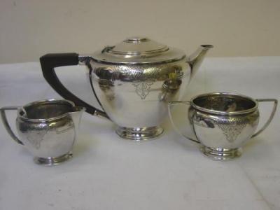 Appraisal: A THREE PIECE TEA SET of circular tapering form with