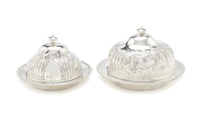 Appraisal: A matched graduating pair of Victorian Edwardian silver breakfast dishes