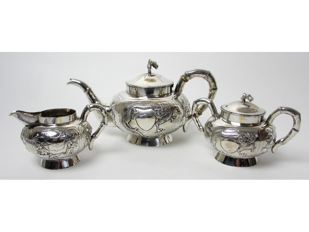 Appraisal: A Chinese silver tea service cast and embossed with dragons