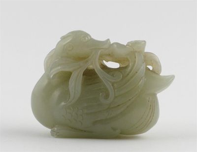 Appraisal: A Chinese celadon jade duck turning his head round holding