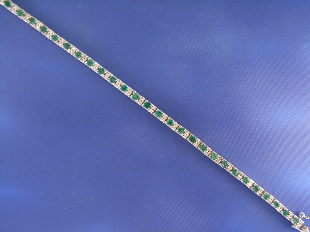 Appraisal: An ct white gold emerald and diamond set line bracelet