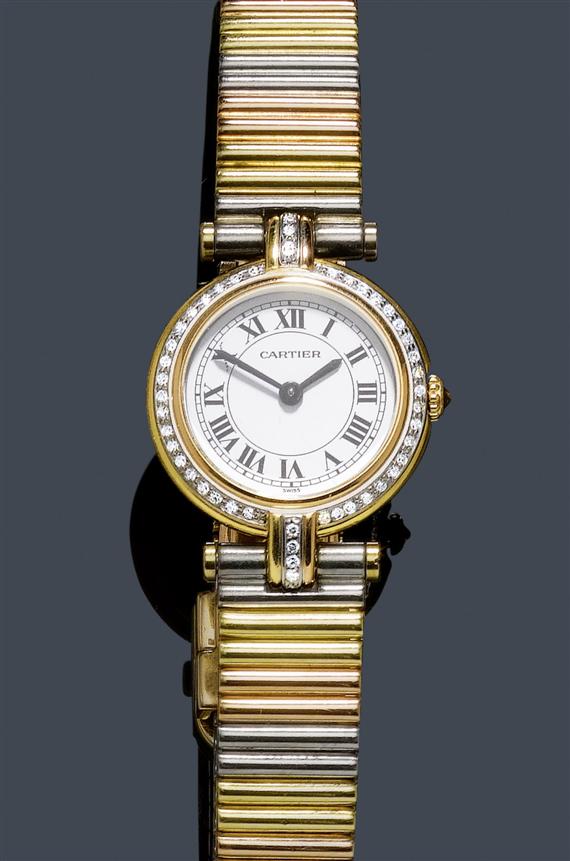 Appraisal: A LADY'S GOLD AND DIAMOND WRISTWATCH CARTIER VEND ME 's