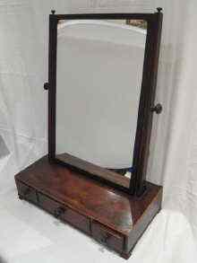 Appraisal: A mahogany dressing table mirror the base with three drawers