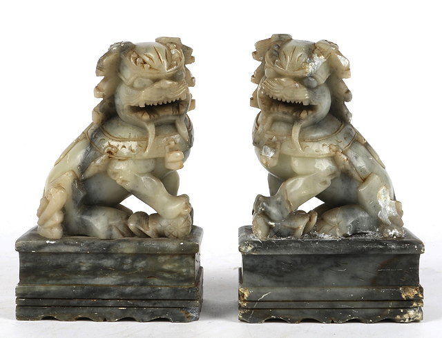 Appraisal: A PAIR OF CHINESE CARVED SOAP STONE TEMPLE LIONS each