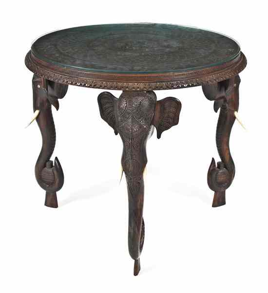 Appraisal: An Indian Carved Teak Occasional Table having a circular top