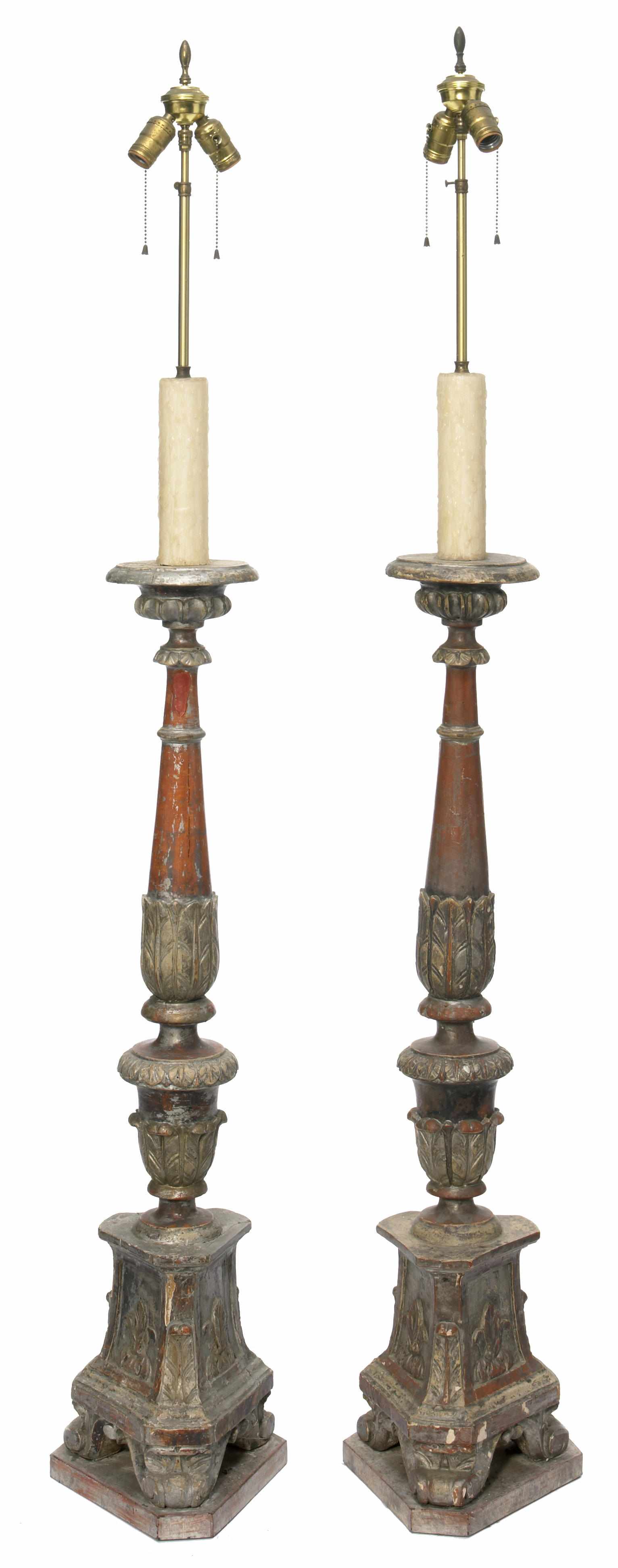 Appraisal: A pair of Renaissance style paint decorated pricket form lamps