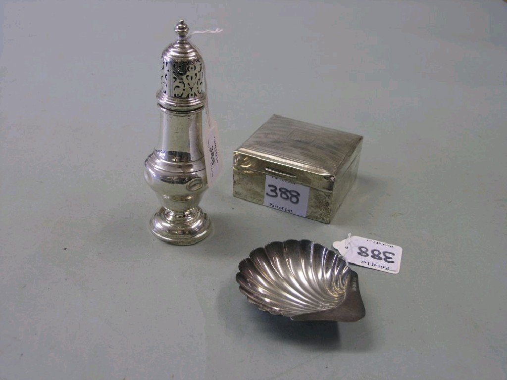 Appraisal: A silver sugar caster Chester together with a silver shell