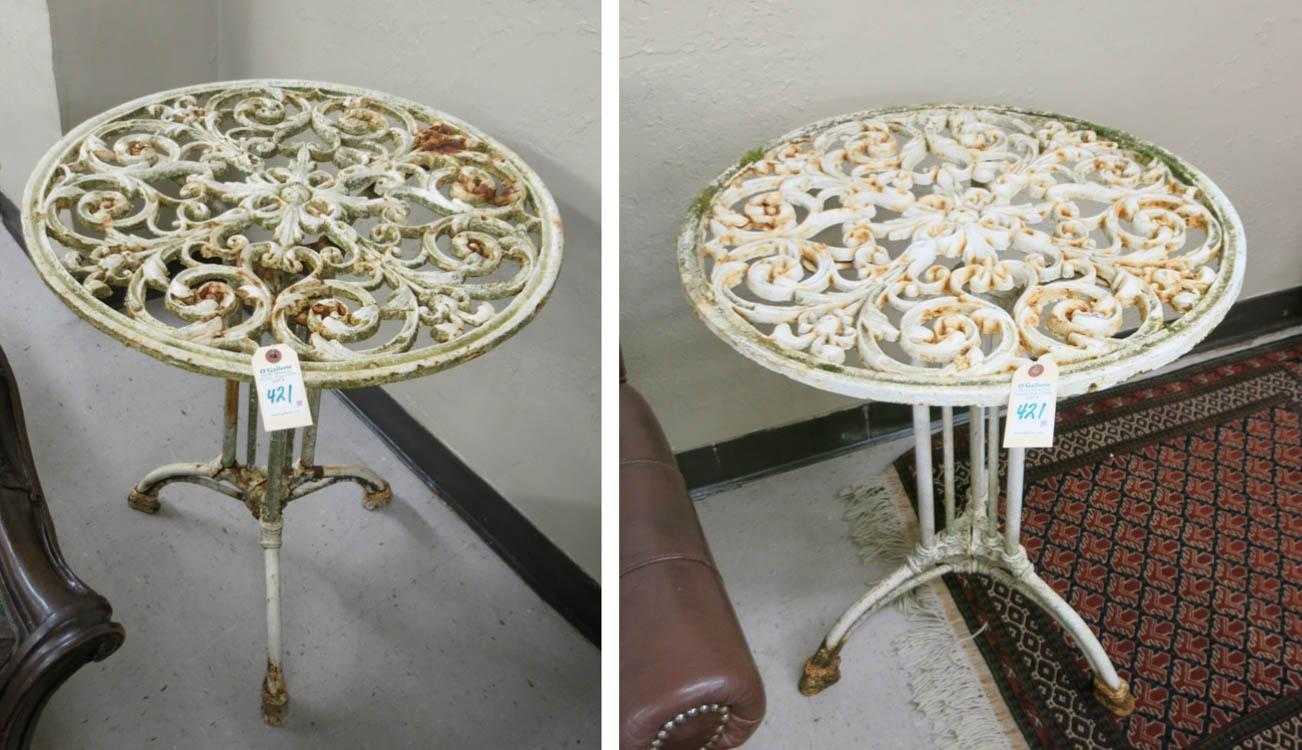 Appraisal: A PAIR OF CAST IRON CAFE TABLES with matching round