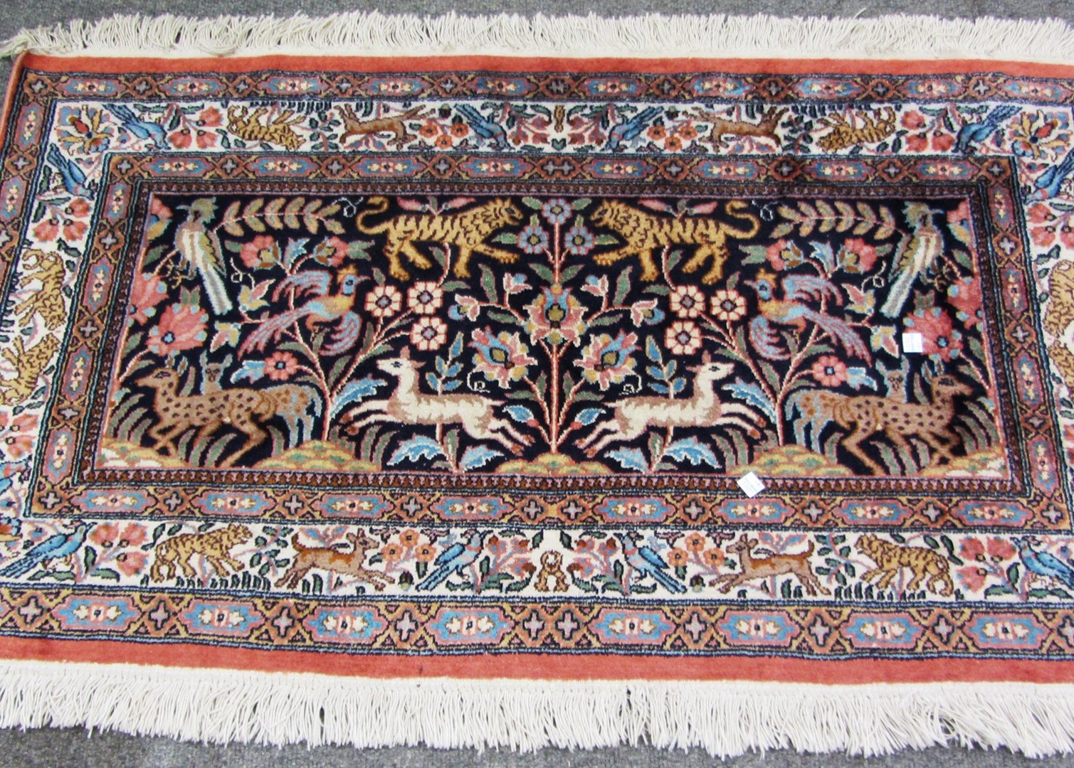 Appraisal: An Indian silk mat the indigo field with jungle animals