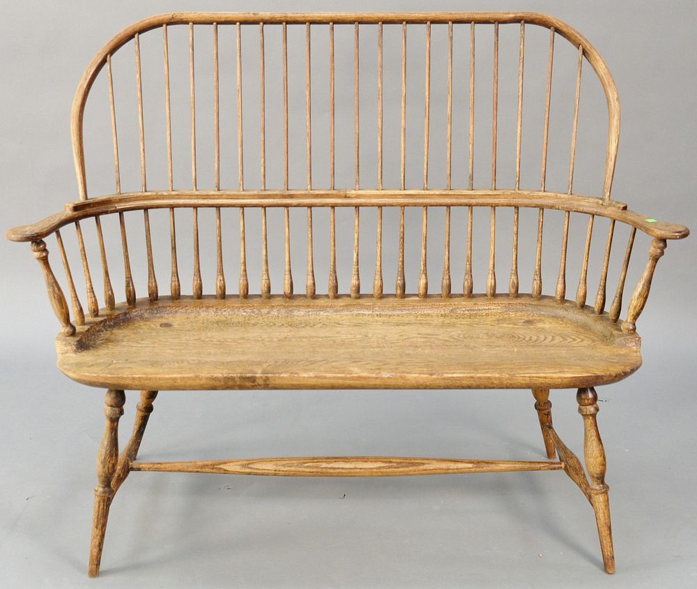 Appraisal: Oak Windsor style bow back bench slightly loose fine split