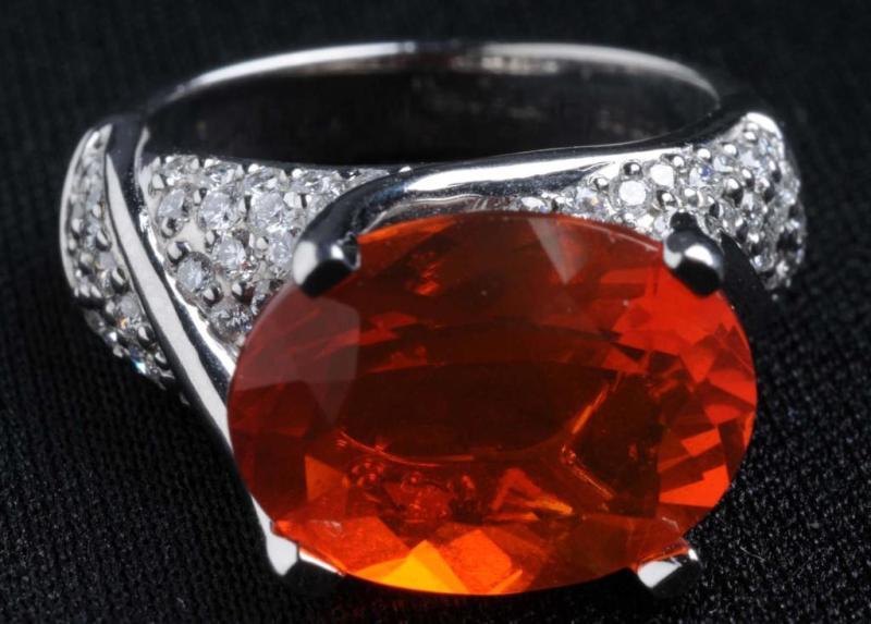 Appraisal: Fire Opal Diamond Ring Description Oval cut opal weighs carats