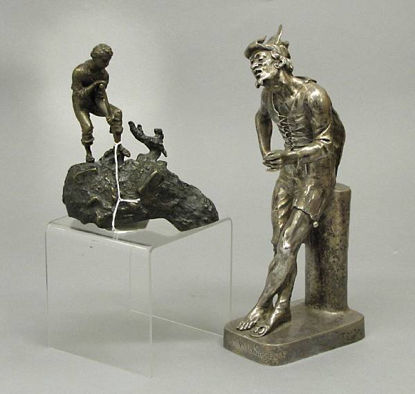 Appraisal: A French silvered bronze figure of a beggar Fou Vendant