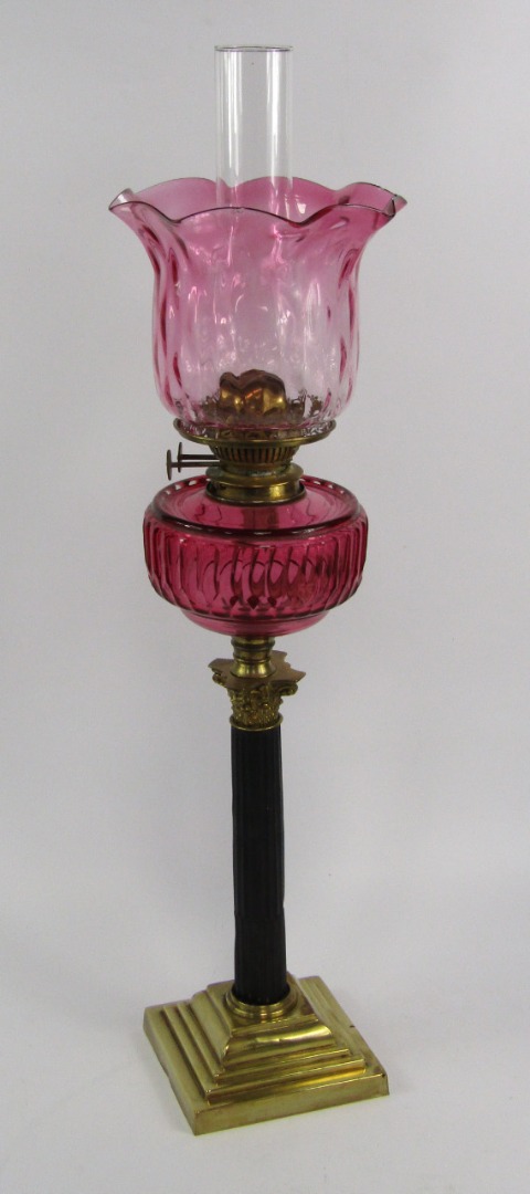 Appraisal: A Duplex brass and blackened metal Corinthian column oil lamp