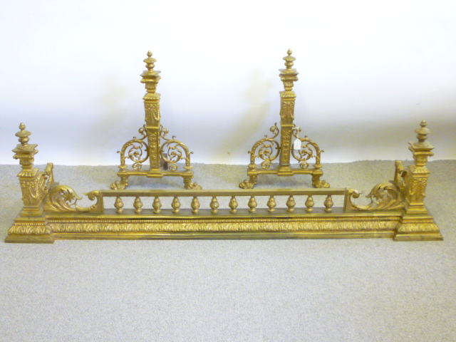 Appraisal: A GILDED BRASS FENDER th century of inverted breakfront form