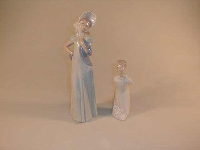 Appraisal: A Lladro figure of a boy in a nightgown and