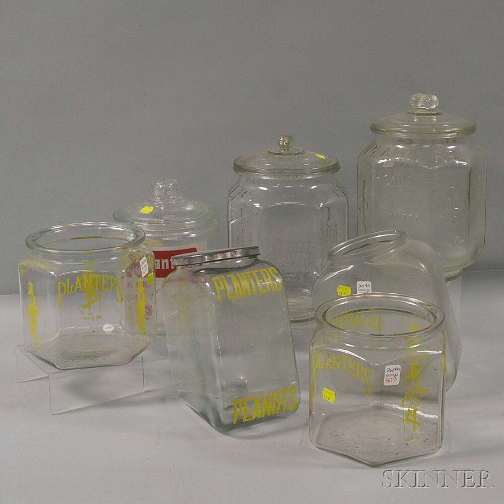 Appraisal: Seven Planters Peanuts Glass Countertop Jars two eight-sided pennant jars