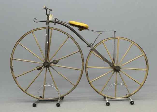 Appraisal: c boneshaker maker unknown '' front rear wooden spoked wheels