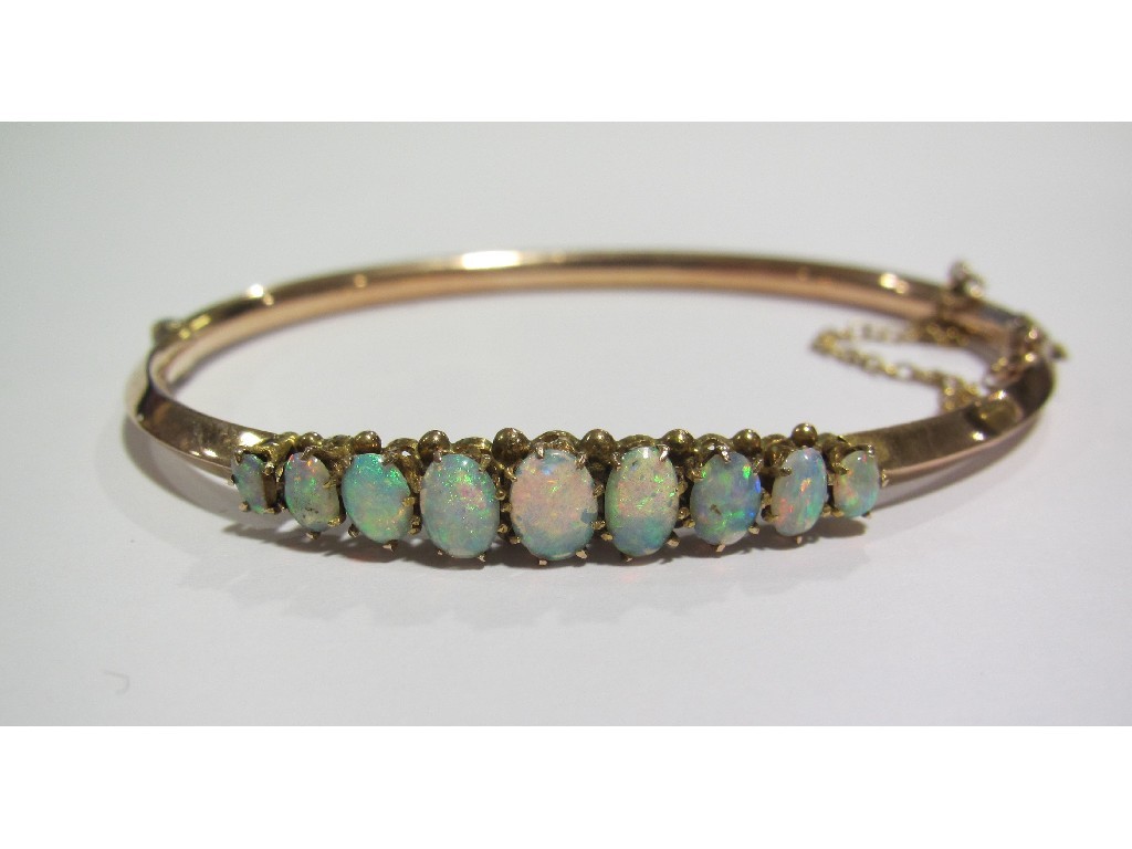 Appraisal: Edwardian ct rose gold stone opal set bangle