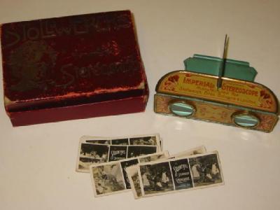 Appraisal: A TIN STEREOSCOPE by Stollwerck Bros the folding front printed