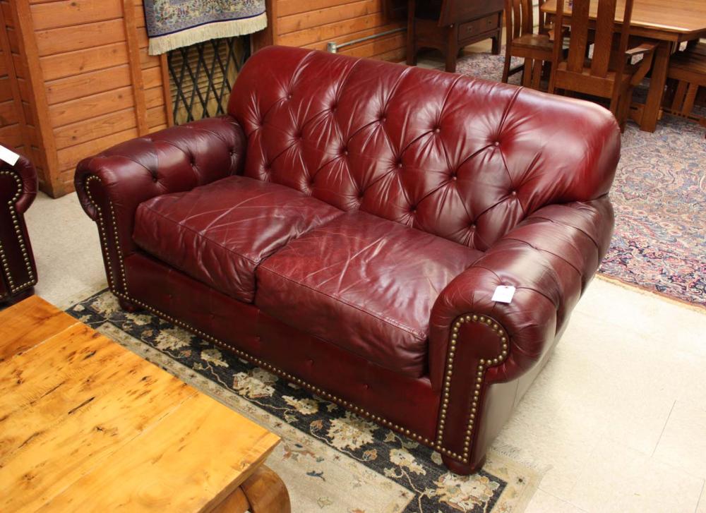 Appraisal: BURGUNDY LEATHER LOVESEAT Leather Masters label H x L