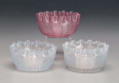 Appraisal: Three latticino glass bowls two white one pink ruffled rims