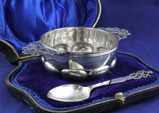 Appraisal: A cased Edwardian silver quaich and matching spoon with pierced