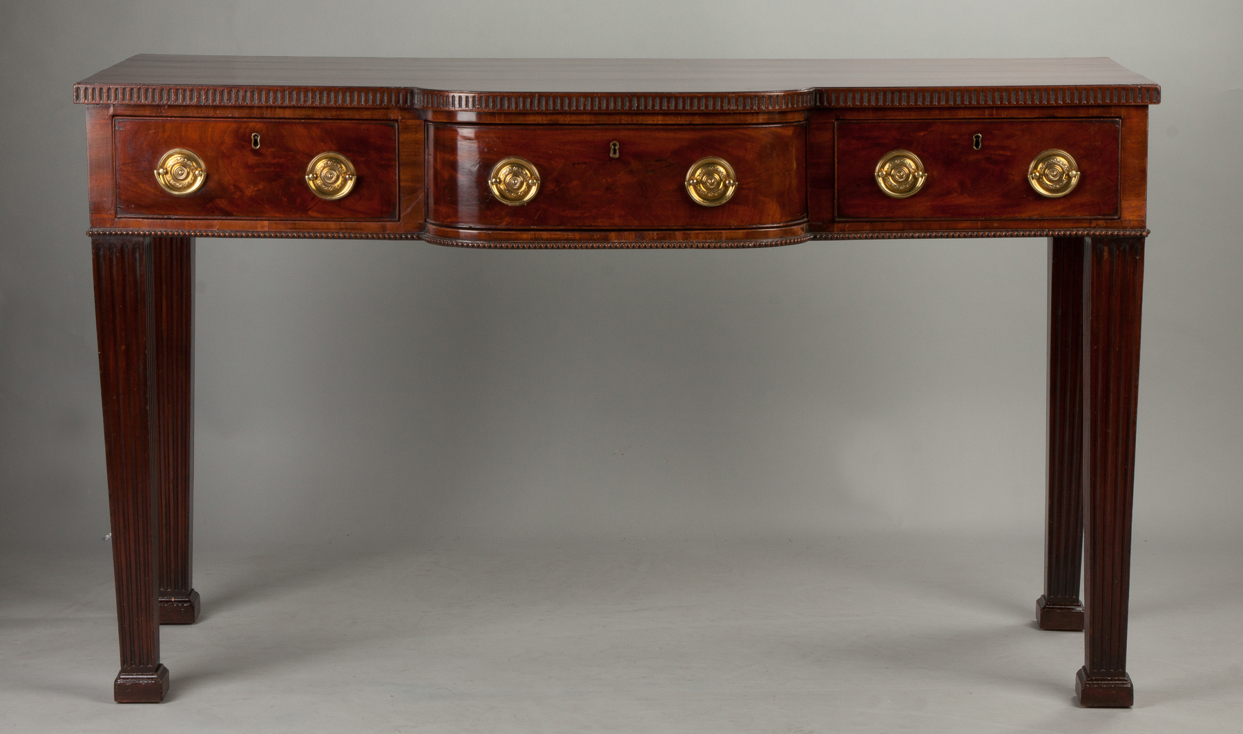 Appraisal: Georgian Figured Mahogany Bowfront Sideboard th century Crossbanded top three