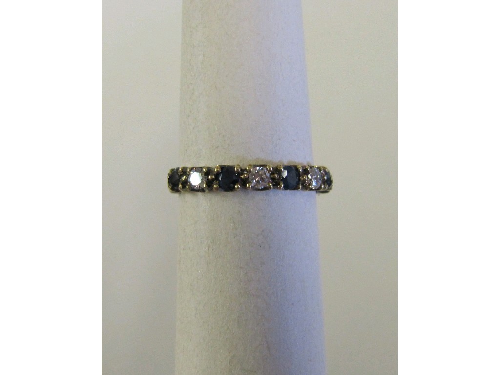 Appraisal: Eighteen carat white gold sapphire and diamond half hoop ring